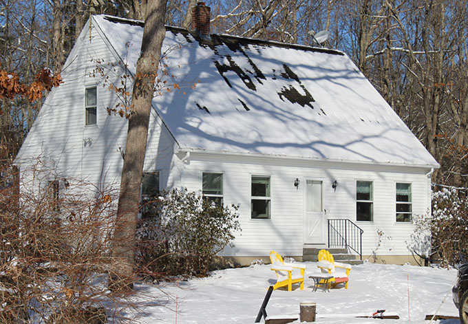 Caretaker cottage, white center door cape, 1.5 stories
